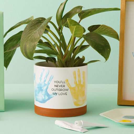 https://www.hallmark.com/dw/image/v2/AALB_PRD/on/demandware.static/-/Sites-hallmark-master/default/dw3378a48c/images/finished-goods/products/1BBY4851/Never-Outgrow-My-Love-Planter-With-Paints_1BBY4851_02.jpg?sw=512&sh=512&sm=fit