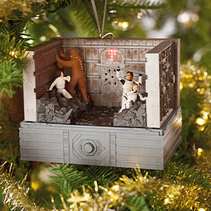 A Star Wars ornament featuring Han, Leia, Luke and Chewbacca