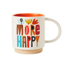 a mug that reads More Happy in colorful lettering