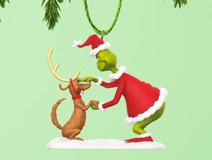 Ornament featuring the Grinch dressed as Santa with Max the dog dressed as a reindeer